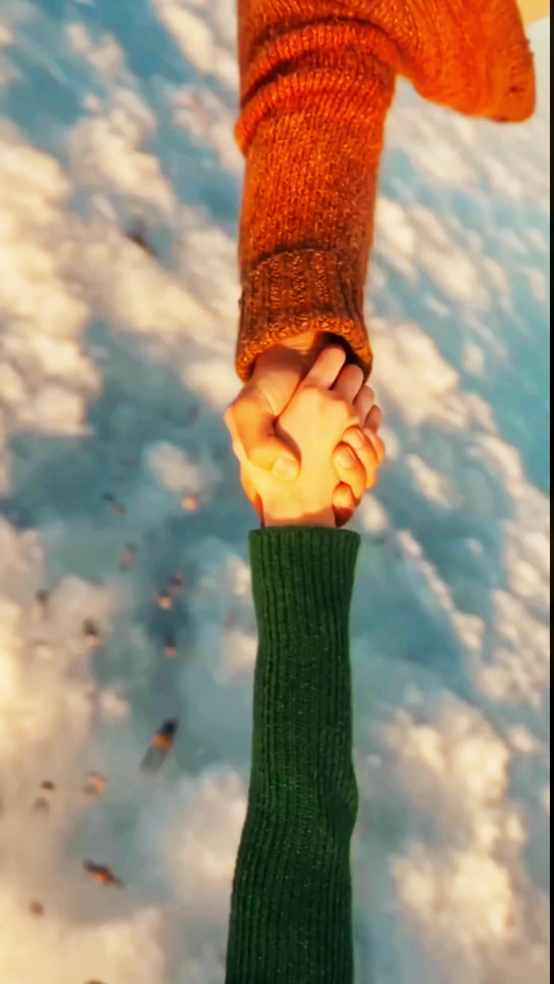 Second 27: their hands catch hold, falling above a cloud field